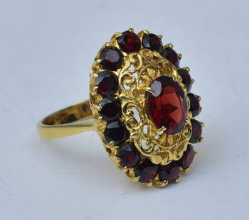 Italian 18k Gold Garnet Ring: center garnet, 8mm x 6mm set with fourteen round garnets in a filigree setting, ring size 8, 24mm x 18mm overall, weight is 6.6 dwt gross,