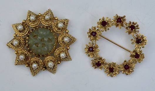 Two 14k Gold Brooches- Jade and Garnet: Carved jade and pearl brooch, 15 mm jade panel, 1 1/2" diameter together with Garnet brooch set with ten garnets, 1 3/8" diameter, weight is 11.2 dwt gross