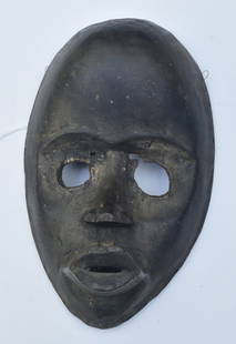 Early African Mask: probably Dan culture, 8 3/4" long, collected by the consignor's father, Walter Skor, in New York City prior to retiring to Connecticut in 1951.