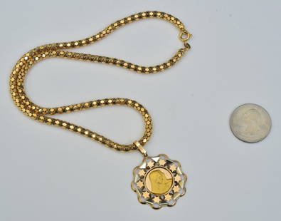 18k Gold Madonna Pendant and Chain: 1 1/4" two tone gold pendant on a 18" long yellow 18k gold braided chain, weight is 14.1 dwt