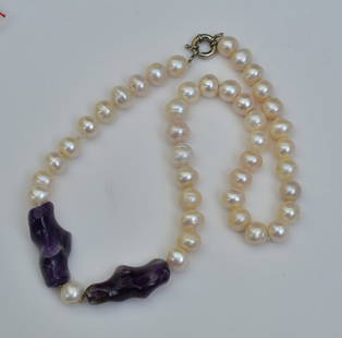 Baroque Pearl and Amethyst Necklace: pearls approximately 10 mm, amethysts approximately 1 1/2" long, overall length is 21" with sterling silver clasps