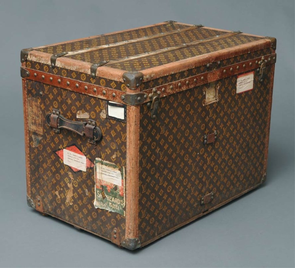 Louis Vuitton Travel Trunk: with oak banding and netted tray and liner 22 1/2" high, 29" wide, 19" deep early 20th century estimate 1200/1800 Buyer is responsible for arranging 3rd party shipping.