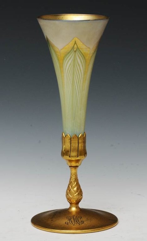 Tiffany Favrile Vase with Bronze Base: with bronze base the pulled feather trumpet form vase signed "L.C.T." with a gold dore base signed "Tiffany Studios/ New York/1043", monogrammed 11 3/4" high overall early 20th century estimate 800/12