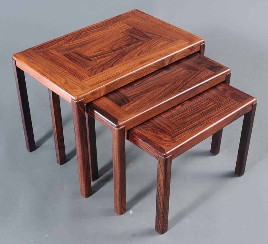 Set of 3 Danish Modern Nesting Tables: largest 17 1/2" high, 24 1/4" wide 15" deep estimate 300/500 Buyer is responsible for arranging 3rd party shipping.