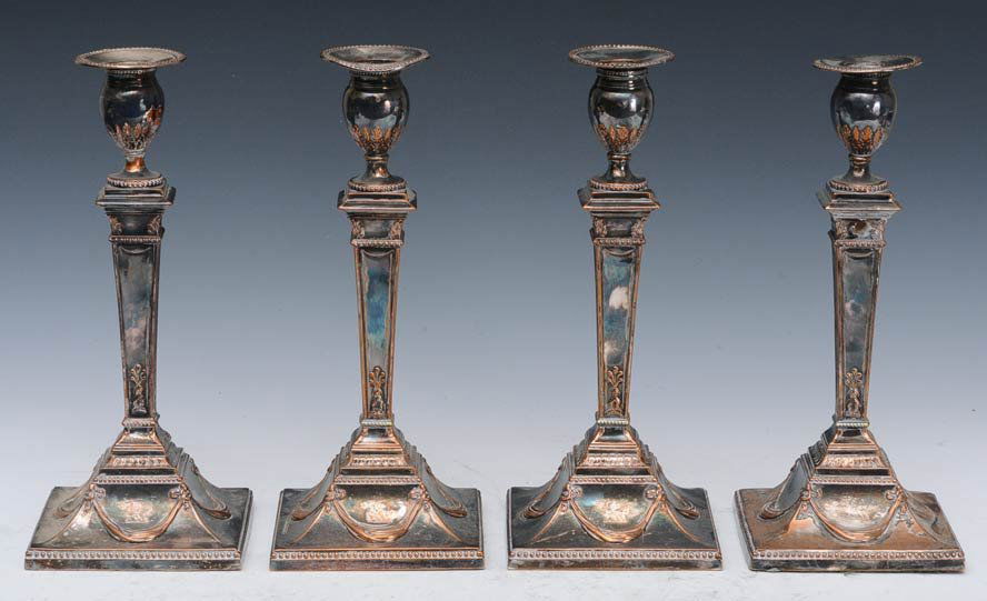 Set of Four Sheffield Candlesticks: Silver plated Adams style 12" high late 19th century estimate 600/900 $40 Shipping available within the Continental USA . This amount excludes insurance which will be calculated based upon the selling