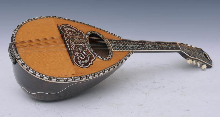 Grauso Mandolin: with rosewood body and intricate inlay estimate 300/500 $40 Shipping available within the Continental USA . This amount excludes insurance which will be calculated based upon the selling price. All In
