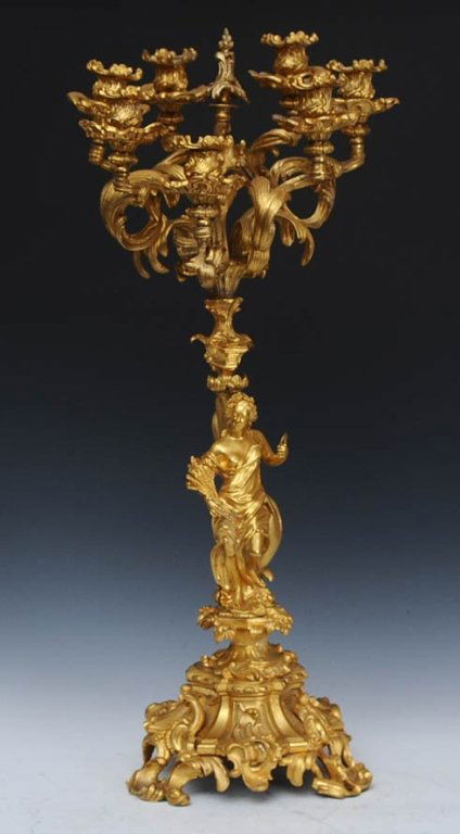 Gilt Bronze Rococo Style Candelabrum: with female figure 29" high late 19th century estimate 600/900 $80 Shipping available within the Continental USA . This amount excludes insurance which will be calculated based upon the selling price.