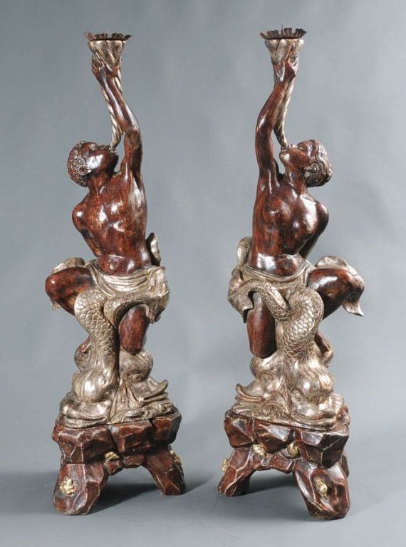 Pair of Italian Carved and Painted Blackamoors: on conforming carved stands 68" high late 20th century estimate 500/750 Buyer is responsible for arranging 3rd party shipping.