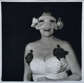 Diane Arbus (American, 1923-1971) Lady at a Masked Ball with Two Roses on her Dress, N.Y.C. 1967