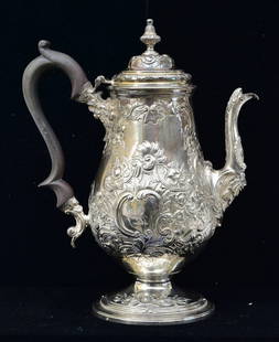 George III Sterling Silver Repousse Coffee Pot: George III Sterling Silver Coffee Pot Abraham Peterson & Peter Podio with ebonized wood handle hallmarked with maker's mark, London and dated 1788 10 1/2" high 30.4 troy ounces gross