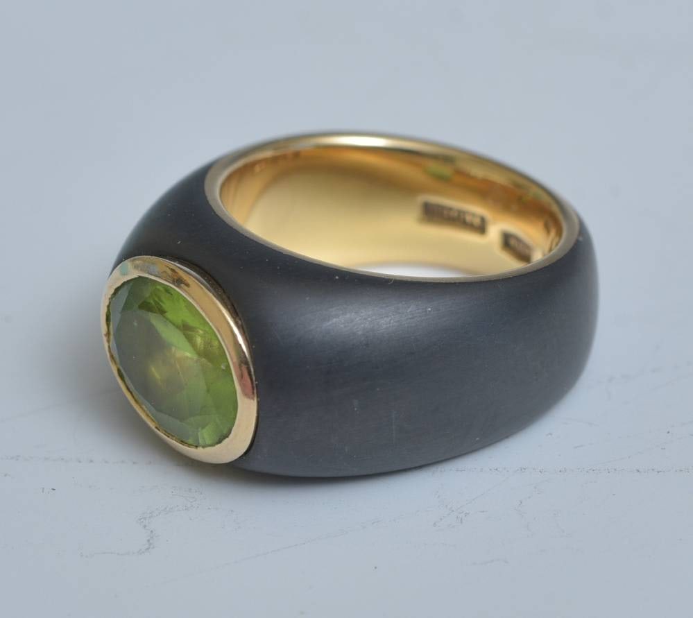 18k Gold and Tungsten Mettalo Peridot Ring: 18k Gold and Tungsten Mettalo Peridot Ring 10mm x 8mm peridot Ring size 6 3/4, stamped "Mettalo 750"