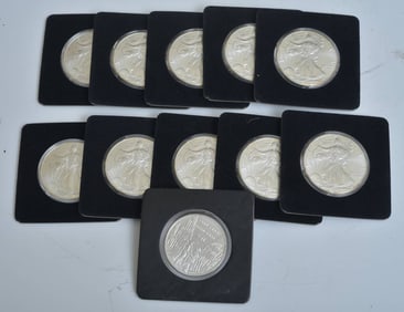 Ten 2002 Walking Liberty Silver Dollars and Commemorative 9/11 Coin