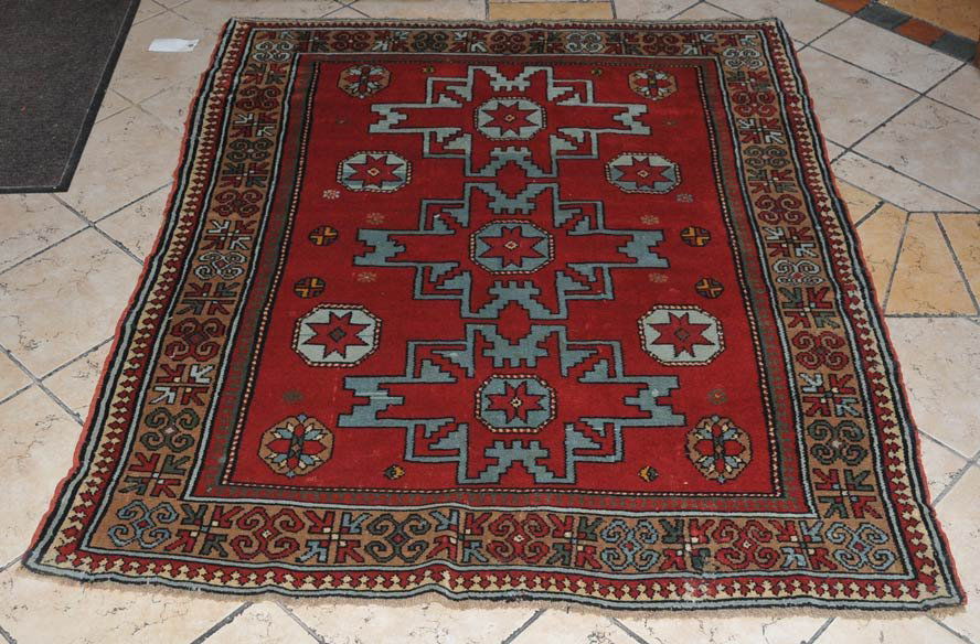 Kazak Style Carpet: 4'4" x 5'5" estimate 350/450 $50 Shipping available within the Continental USA . This amount excludes insurance which will be calculated based upon the selling price. All International shipping will b