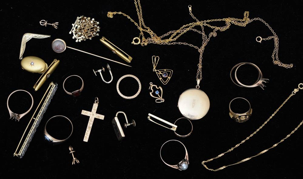 Group of Gold Jewelry: including chains, cross, class ring, locket, mostly 14kt gold 39.3 dwt gross estimate 500/750 Shipping available within the Continental USA : $20. International shippers are responsible for arranging 