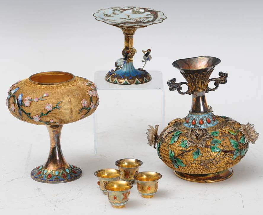Three Chinese Enameled Silver Table Ornaments: together with four small cups estimate 300/500 $40 Shipping available within the Continental USA . This amount excludes insurance which will be calculated based upon the selling price. All Internation