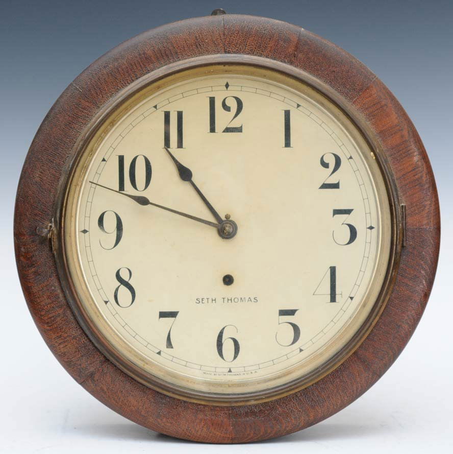 Seth Thomas Oak Gallery Clock: face 11" diameter overall 16" diameter estimate 100/150 Shipping available within the Continental USA (excludes insurance) $50. International shippers are responsible for arranging 3rd party shipping.