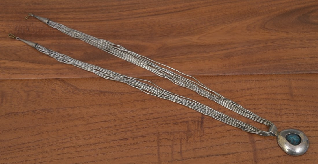 Native American Turquoise Necklace: Native American Turquoise Necklace the silver pendant 1 1/2" long set with a turquoise stone, 12.4 mm x 9.4 mm 24" beaded necklace 54 grams gross IN HOUSE SHIPPING Within Continental USA $25 DURING CH