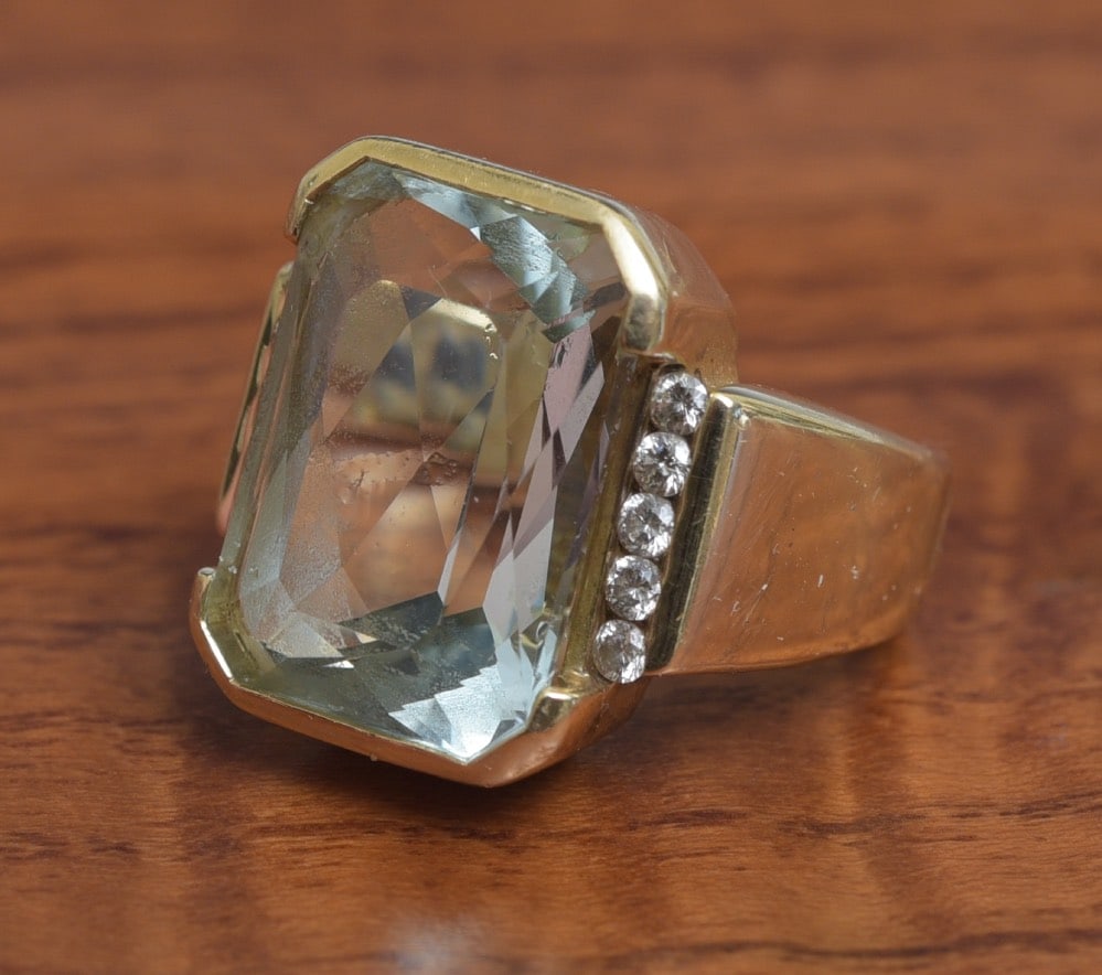 14k Gold Aquamarine and Diamond Ring: 14k Gold Aquamarine and Diamond Ring 17.4 mm x 13.2 aquamarine set with 10 diamonds ring not marked, but tests 14k gold ring size 6 1/2, weight is 17.8 grams gross IN HOUSE SHIPPING Within Continental