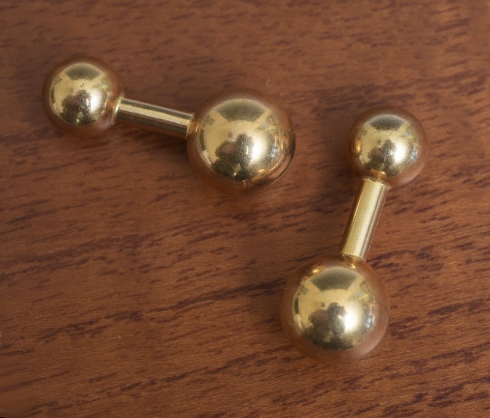 Tiffany & Co 14k Gold Cuff Links: Tiffany & Co 14k Gold Cuff Links in the form of balls, 1 1/8" long signed Tiffany & Co 14k" weight is 9.7 grams IN HOUSE SHIPPING Within Continental USA $25 DURING CHECKOUT CHOOSE "ARRANGE MY OWN SHIP