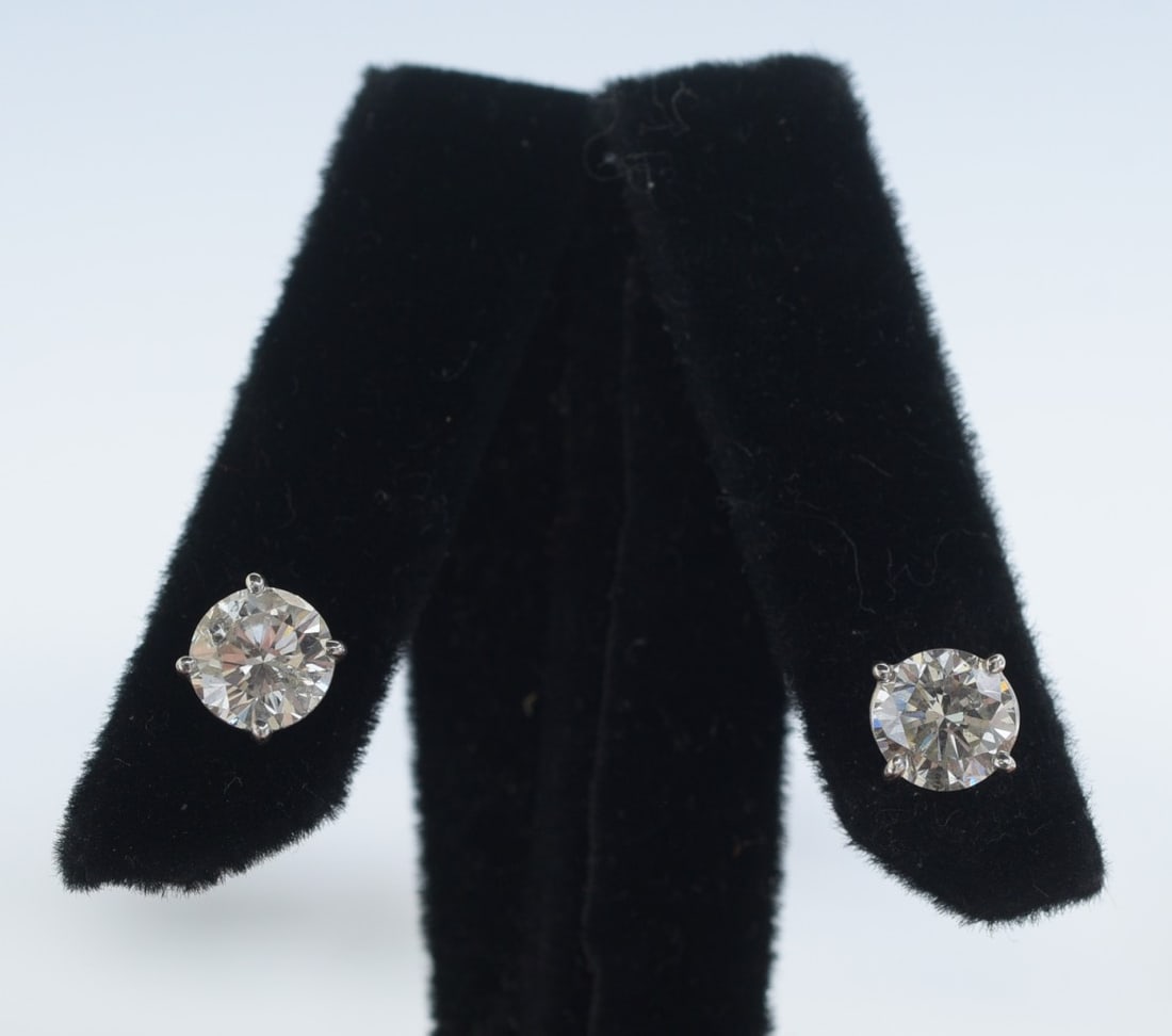 14k Gold Diamond Stud Earrings- Each approximately 1 ct: 14k Gold Diamond Stud Earrings- Each approximately 1 ct J/K color, scattered inclusions- SI1 clarity, not marked, but tests 14k gold, weight 1.6 grams gross IN HOUSE SHIPPING Within Continental