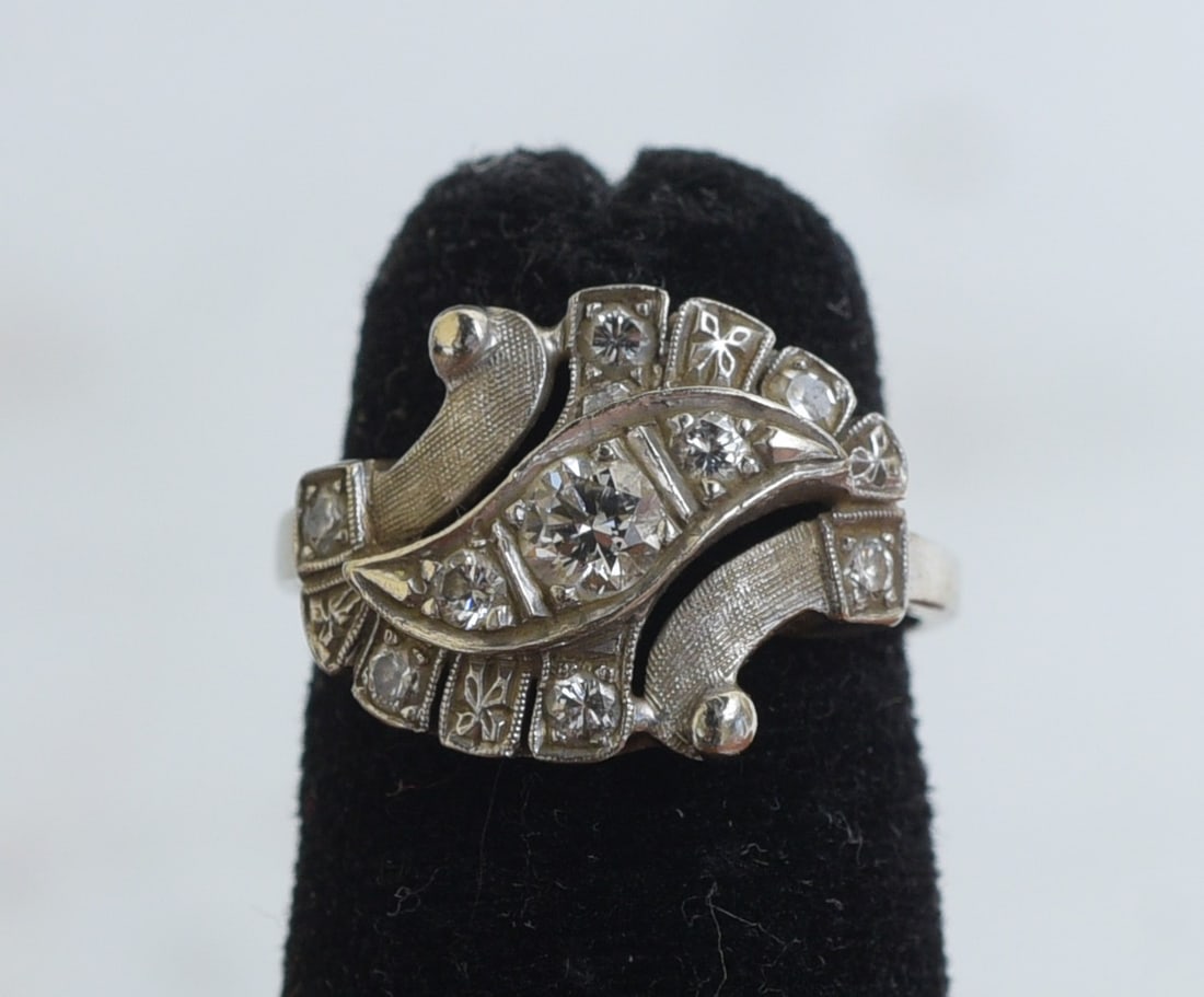 14k Gold Retro Style Diamond Ring: 14k Gold Diamond Ring center diamond approximately .30 ct set with 8 accent diamonds ring size 5 4.4 grams gross IN HOUSE SHIPPING W/I continental USA $45 DURING CHECKOUT CHOOSE "ARRANGE MY OWN