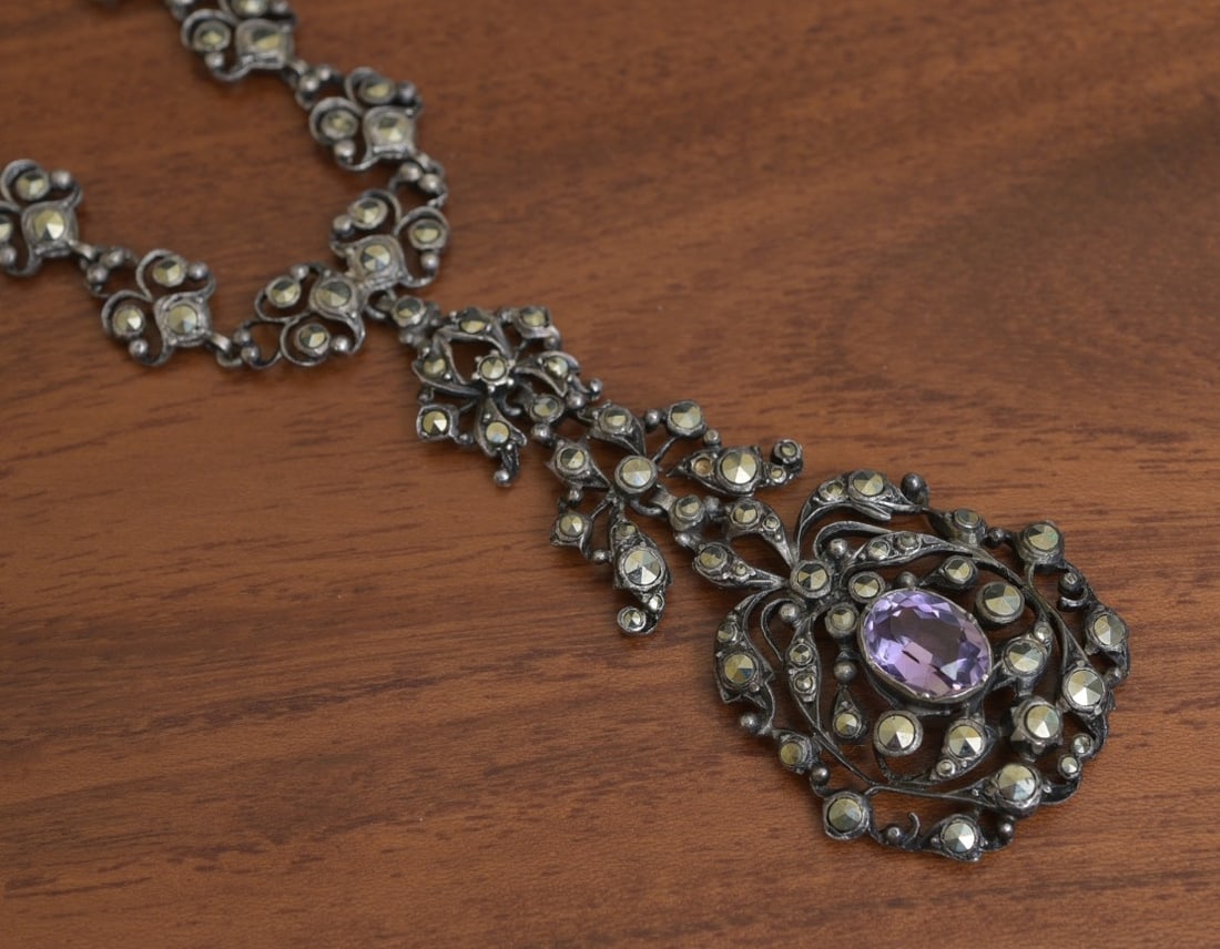 German Silver and Marcasite Necklace with Amethyst: German Silver and Marcasite Necklace with Amethyst 17 1/2" long with 2 1/2" pendant stamped "935 Germany" weight is 43 grams gross IN HOUSE SHIPPING W/IN continental USA $25 DURING CHECKOUT CHOOSE "AR