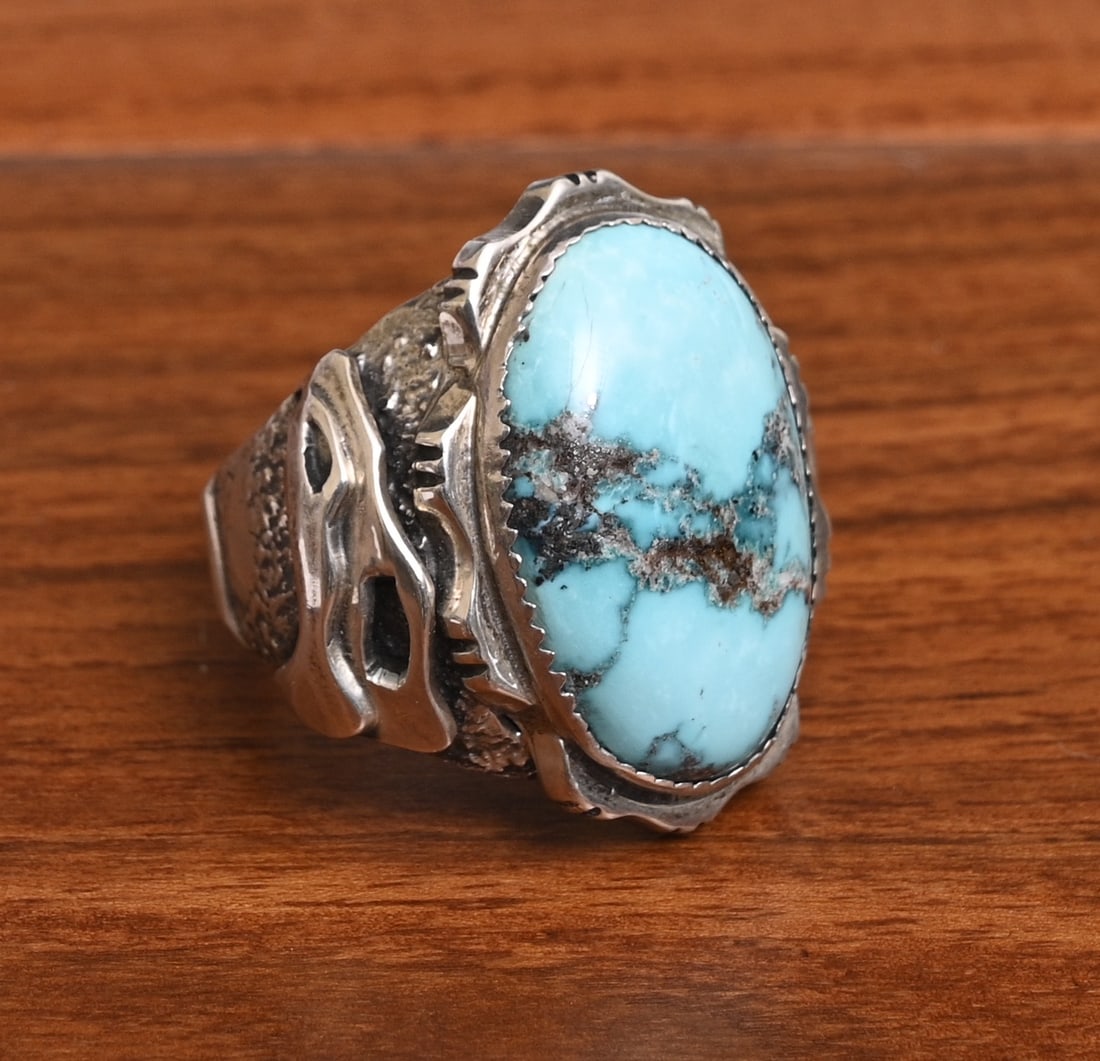 Large Dan Nieto Turquoise and Sterling Silver Ring, Zuni artist: Large Dan Nieto Turquoise and Sterling Silver Ring, Zuni artist 27 mm x 20 mm turquoise ring size 11 1/2, weight is 31.9 grams gross stamped "Dan Nieto" "Sterling" IN HOUSE SHIPPING within the Contine