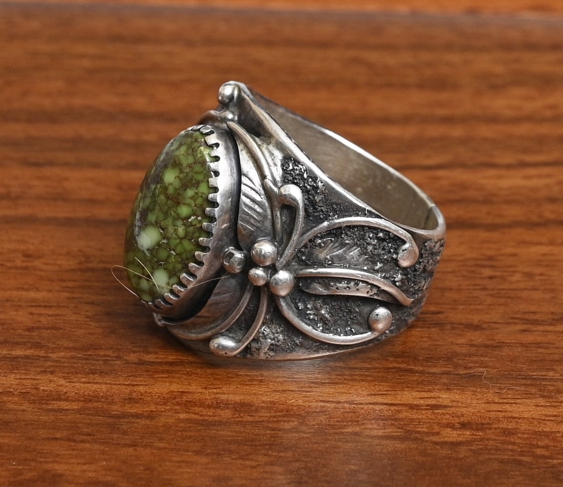 Dan Nieto Sterling Silver Ring, Zuni artist: Dan Nieto Sterling Silver Ring, Zuni artist floral motif with green hard stone 15 mm x 9 mm ring size 10 1/4, weight is 17.7 grams gross stamped "Dan Nieto" "Sterling" IN HOUSE SHIPPING within the Con