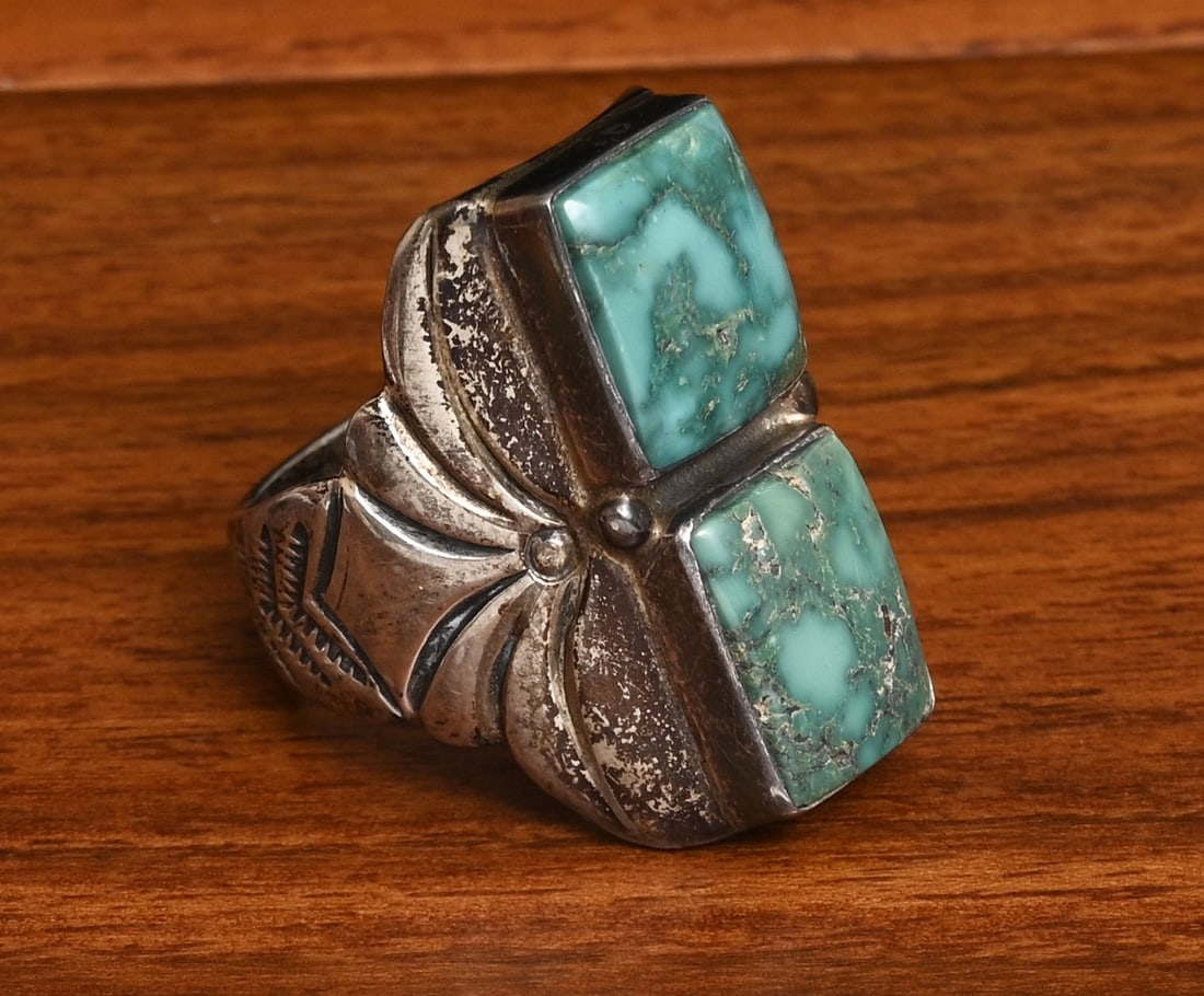 Orville Tsinnie Navajo Sterling Silver Turquoise Ring: Orville Tsinnie Navajo Sterling Silver Turquoise Ring two turquoise stones, each 14 mm x 12 mm ring size 12 1/2, weight is 25.3 grams stamped "Orville Tsinnie of New Mexico", "STERLING" IN HOUSE SHIPP
