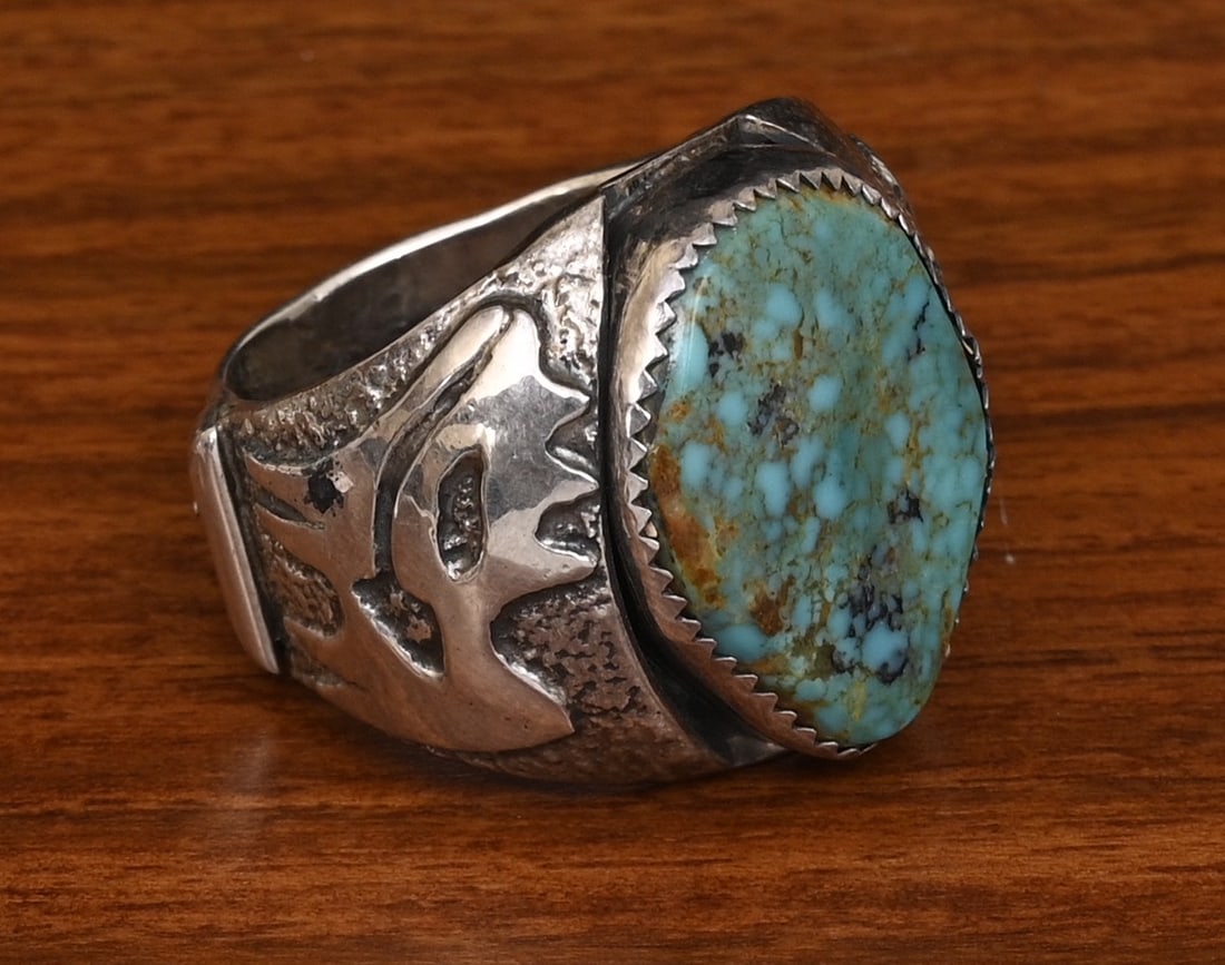 Dan Nieto Turquoise and Sterling Silver Ring, Zuni artist: Dan Nieto Turquoise and Sterling Silver Ring, Zuni artist Animal and arrow motif, 22 mm x 16 mm turquoise ring size 11 3/4, weight is 22.8 grams gross stamped "Dan Nieto" "Sterling" IN HOUSE SHIPPING 