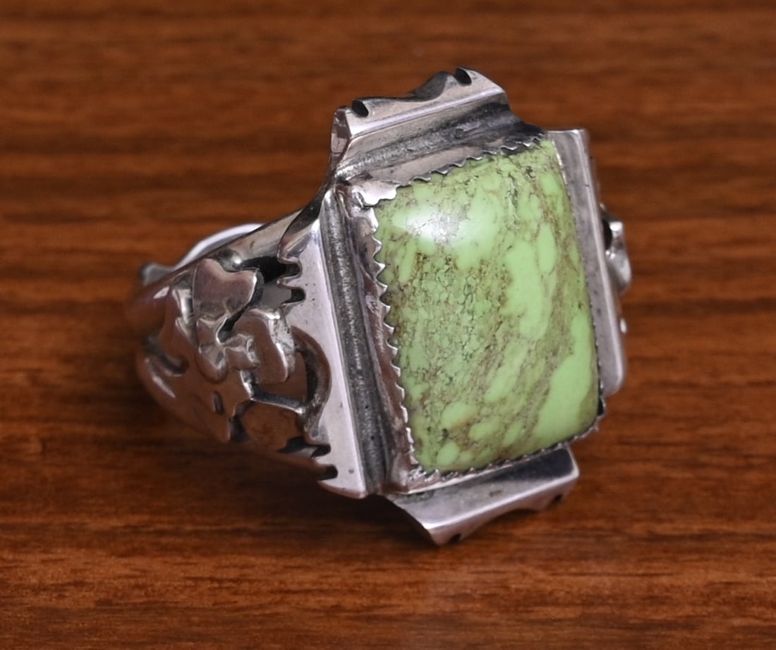 Dan Nieto Sterling Silver Ring, Zuni artist: Dan Nieto Sterling Silver Ring, Zuni artist Floral motif, 18 mm x 13 mm green hard stone ring size 13, weight is 16.3 grams gross stamped "Dan Nieto" "Sterling" IN HOUSE SHIPPING within the Continenta