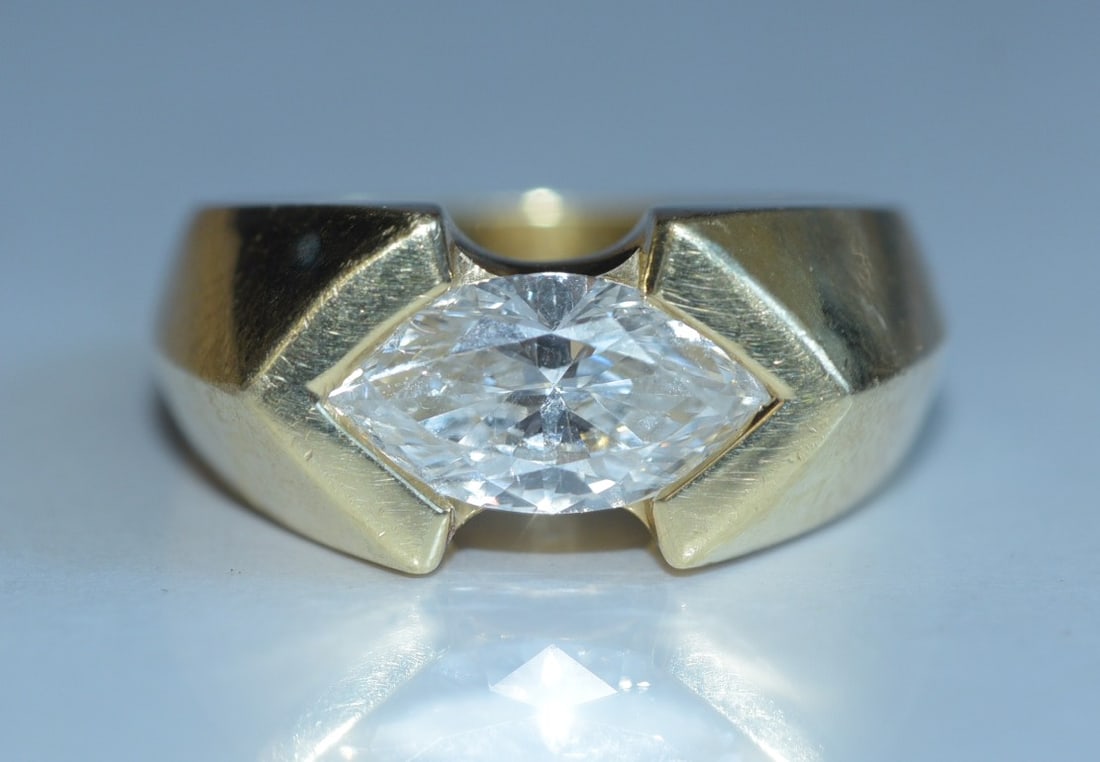 18k Gold Diamond 3 Ct Solitaire Ring: 18k Gold Diamond Solitaire Moderne Ring approximately 3 ct marquise diamond, K/L color, SI clarity, ring size 11, weight is 17.4 grams gross stamped 18k IN HOUSE SHIPPING within the Continental USA $3