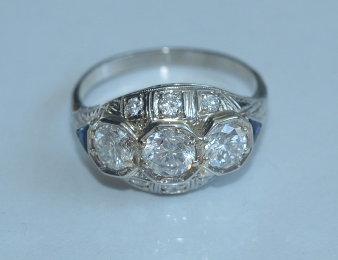 18k Gold Edwardian Diamond Ring: 18k White Gold Edwardian Ring with three central diamonds, approximately .45 ct, .50 ct and .65 ct set with six additional smaller side diamonds ring size 8 3/4, weight is 4.1 grams gross stamped 18k 