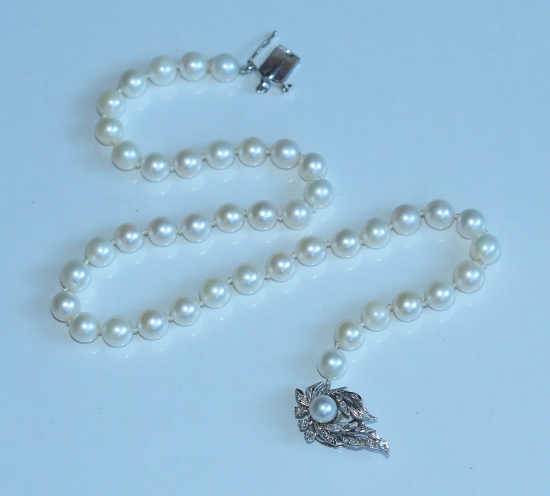 14k Gold Diamond Pearl Necklace: Cultured Pearl Necklace, 7mm pearls, 16" long with 14k gold diamond clasp, 1 1/8" x 3/4" 32.7 grams gross IN HOUSE SHIPPING within the Continental USA $25. DURING CHECKOUT, CHOOSE "ARRANGE MY OWN SHIP
