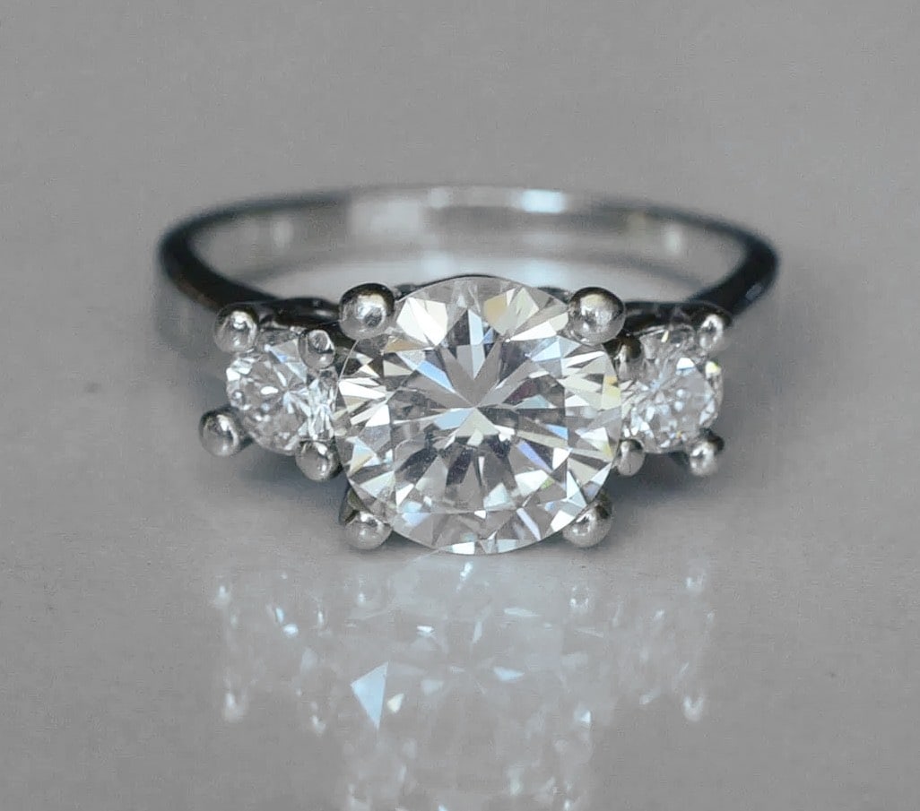 14k White Gold 2 ct Round Brilliant Cut Diamond Solitaire Ring: 14k White Gold 2 ct Round Brilliant Cut Diamond Solitaire Ring approximately 2 ct center diamond, J/K color, VS clarity set with two side diamonds each approximately .25 cts, J/K color, I clarity ring