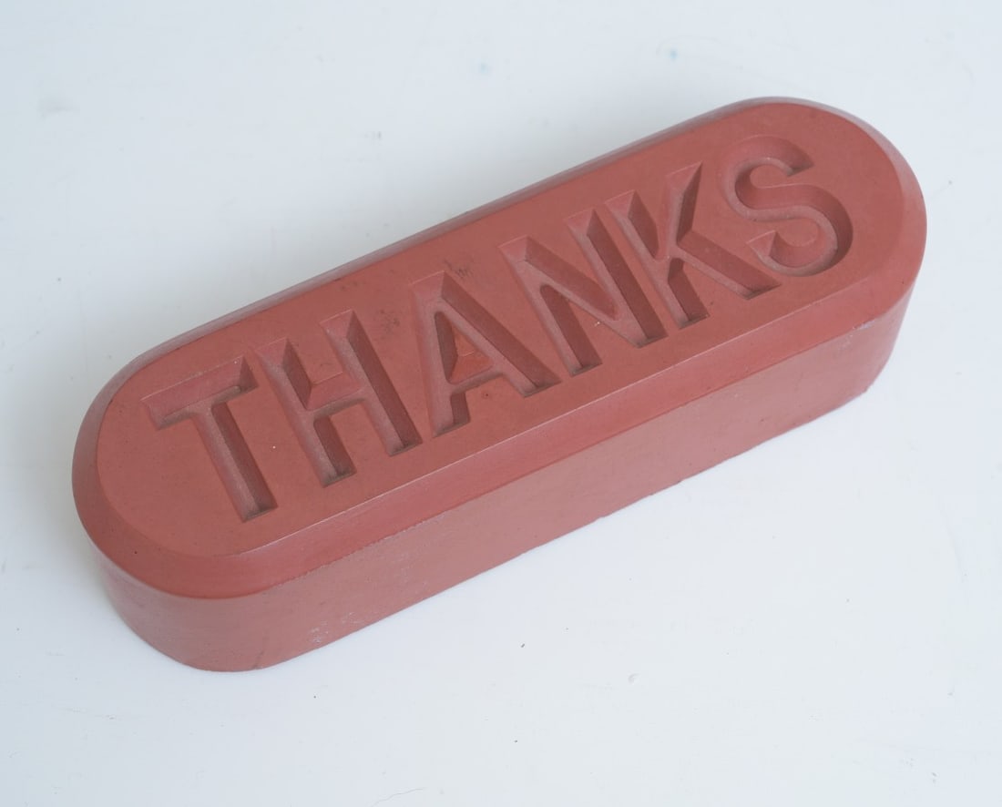 ALLAN MCCOLLUM, "Thanks" Cast Polymerized Concrete: ALLAN MCCOLLUM, "Thanks" Cast Polymerized Concrete from Visible Marker Series, 1997 published by I.C. Editions, Inc., New York 7 7/8" long signed and dated in black ink on the felt pad on the