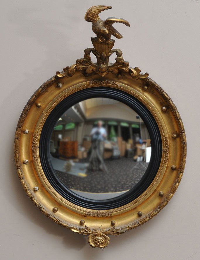 Federal Giltwood Convex Mirror: surmounted by an eagle with federal shield 40" high, 28" wide circa 1820 estimate 1000/1500 Buyer is responsible for arranging 3rd party shipping.