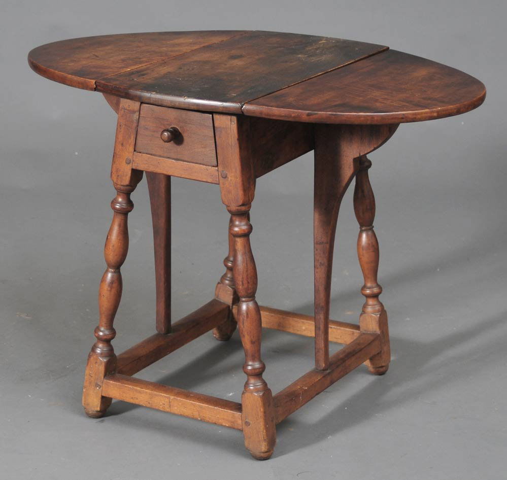 Diminutive Queen Anne Butterfly Drop Leaf Table: maple with some figuring to top drawer at end 23 1/4" long 33" wide (open) 24 1/4" high, 18th century estimate 2500/3500 Buyer is responsible for arranging 3rd party shipping.