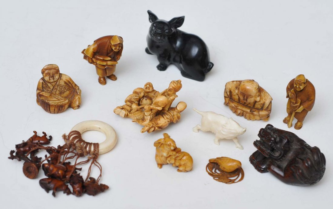 Grouping of Japanese Netsukes and Carvings: eleven total including stone rabbit and a boxwood fu dog late 19th century estimate 400/600 SHIPPING INFORMATION Shipping available within the Continental USA (excludes insurance) $25. International b