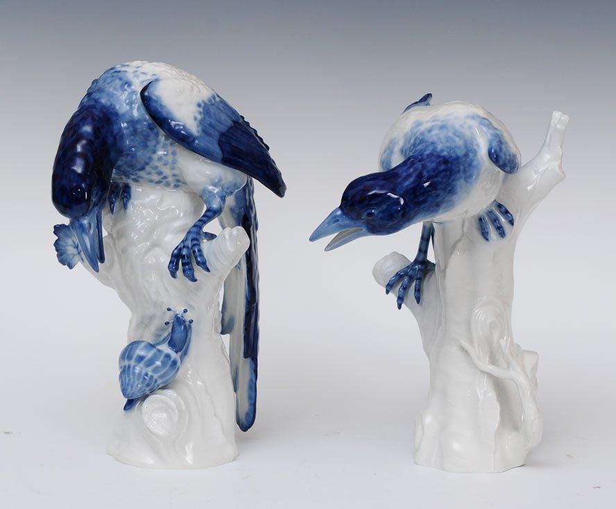 Pair of KPM Birds on Branches: one with a snail each with scepter mark 11" high estimate 250/350SHIPPING INFORMATIONShipping available within the Continental USA (excludes insurance) $40. International shippers are responsible for