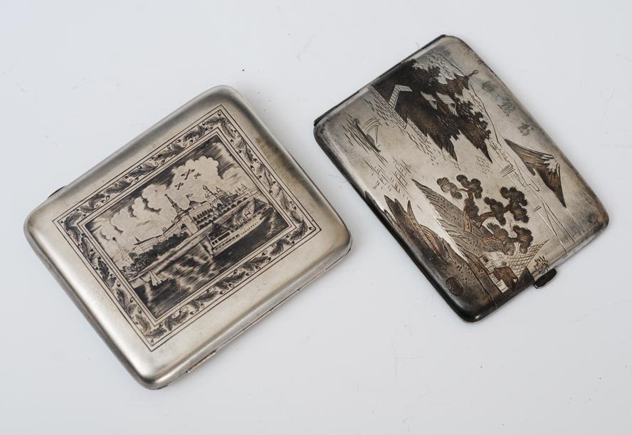 Russian Silver Cigarette Case: with Niello engraved harbor scene with airplanes, stamped 84 touchmark together with a similar Japanese silver cigarette case 9.8 troy ounces (combined)estimate 300/500 SHIPPING INFORMATION Shipping a