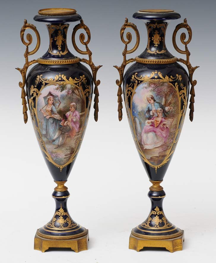 Pair French Sevres Style Urns: 15 1/2" high (lacking covers) early 20th century estimate 300/500SHIPPING INFORMATIONShipping available within the Continental USA (excludes insurance) $45. International buyers are responsible for ar