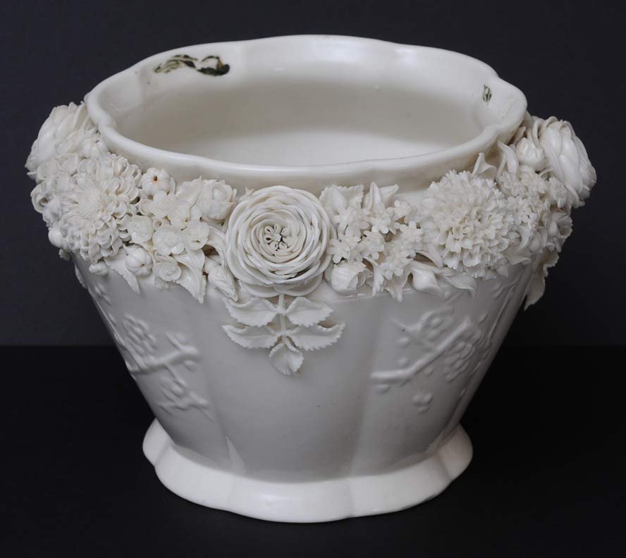 Belleek Jardinaire: with flowers at rim 7" high, 9 1/2" diameter estimate 500/750 SHIPPING INFORMATION Shipping available within the Continental USA (excludes insurance) $40. International buyers are responsible for arra