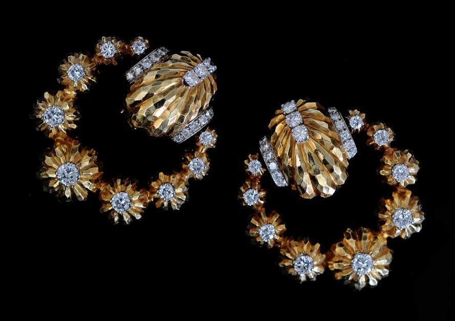 Pair of David Webb Earrings: 18k gold and platinum set with diamonds each 1 3/4" long 32.4 dwt gross estimate 4000/6000 SHIPPING DETAILS: Shipping available within the Continental USA (excludes insurance) $20. International buyer