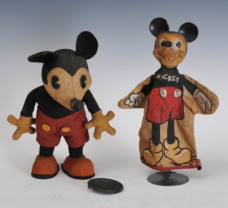 Mickey Mouse Grouping (3): including cloth Mickey, 10 1/2" high, circa 1930's, 10" puppet with rubber head and Mickey Mouse brass buckle, 2 3/8" diameter estimate 400/600 SHIPPING DETAILS: Shipping available within the Continen