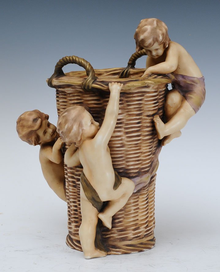Amphora Basket: climbed by three cherubs 13" high estimate 300/500