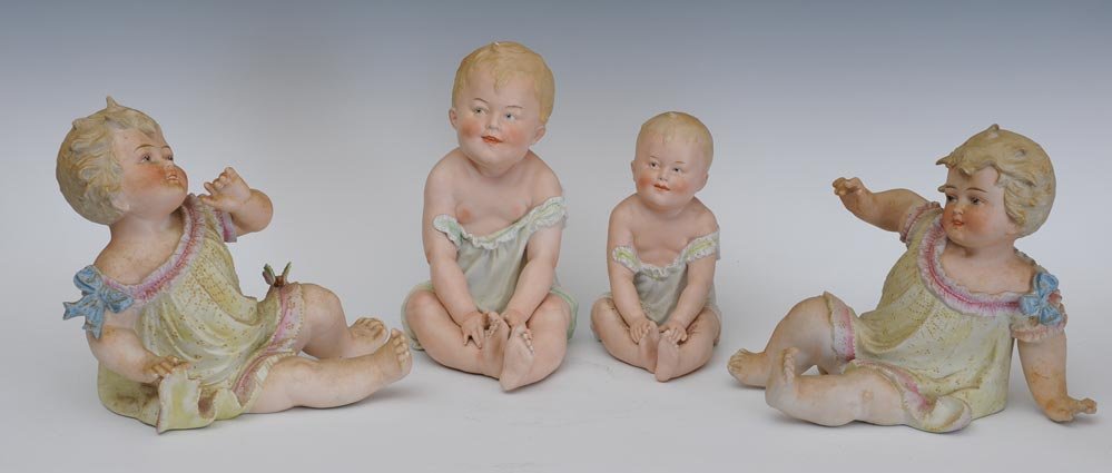 Group of Four German Piano Babies: largest 10" high circa 1900 estimate 400/600