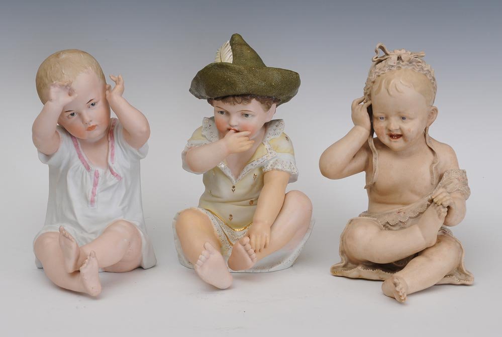 Group of Three Victorian Piano Babies: largest 11" high circa 1900 estimate 400/600