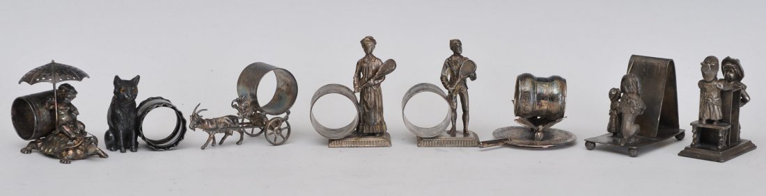 Group of 8 Silverplated Figural Napkin Rings: including tennis players estimate 400/600