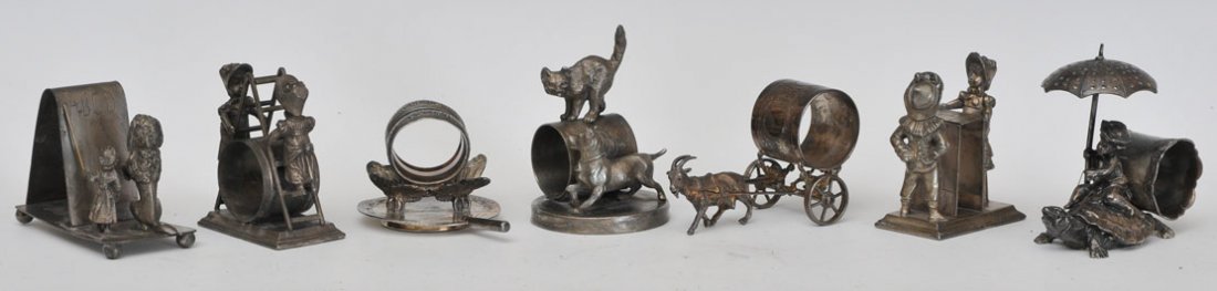 Group of 7 Silverplated Figural Napkin Rings: including cats and dogs estimate 400/600